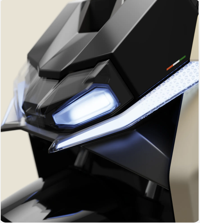 Side profile of Ultraviolette Tesseract showcasing aggressive styling, LED headlight, and wide apron